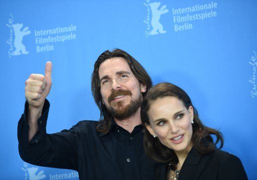 US actor Natalie Portman and British actor Christian Bale pose at a photo shoot for \