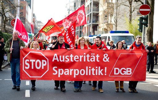 Demonstrators of the German trade union walk peacefully through Frankfurt\