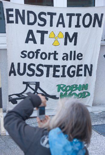 A vigil is held prior to the beginning of the trial against two protesters who participated in a blockade to stop a castor transport in December 2010 at the regional court in Stralsund, Germany, 20 April 2015. The banner reads \