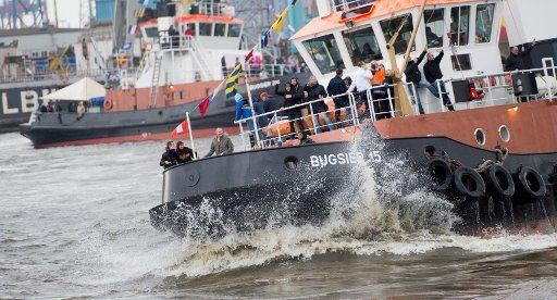 Tugboats perform a traditional tugboat ballet on the river Elbe in Hamburg, Germany, 9 May 2015. More than a million visitors are expected by 10 May for the 826th birthday of the Port of Hamburg. PHOTO: DANIEL REINHARDT\/