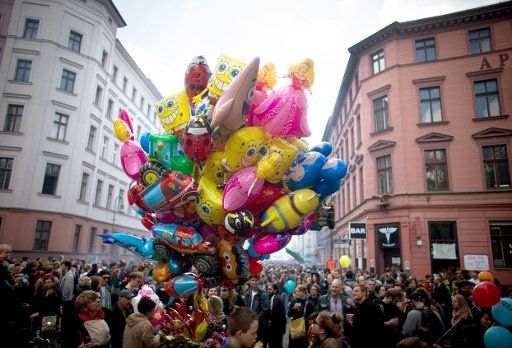 Numerous visitors and colorful balloons take part in the \