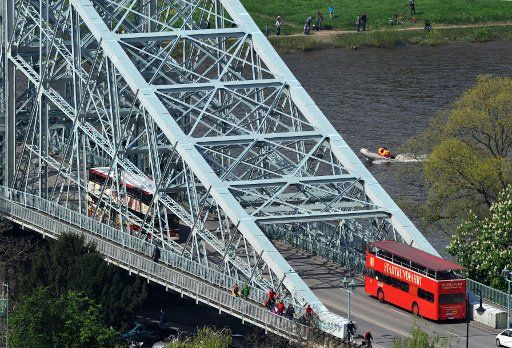 A city tour bus rides of over the Loschwitz Bridge, known to locals at the \