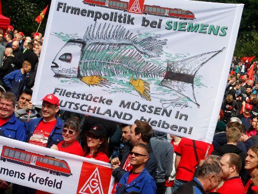 Siemens employees protest at the IG Metall rally with the slogan \