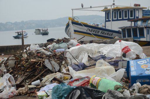 A mooring place for fishing boats is littered with rubbish at Guanabara Bay, Brazil, 27 July 2015. Olympic sailing events are scheduled to take place near this location in 2016. Photo: Georg Ismar\/