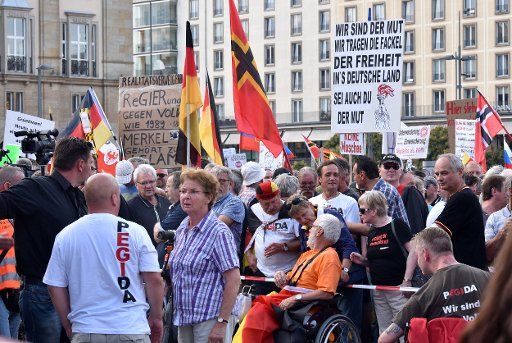 People gather for a rally of anti-Islam movement Pegida (\