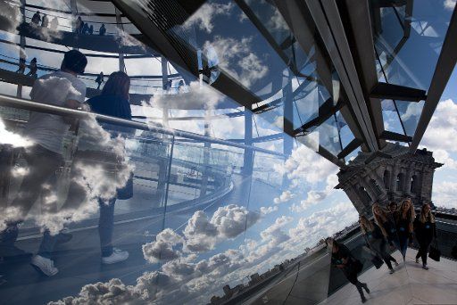 Clouds reflect in the dome of the Reichstag building in Berlin, Germany, 29 September 2015. PHOTO: KAY NIETFELD\/