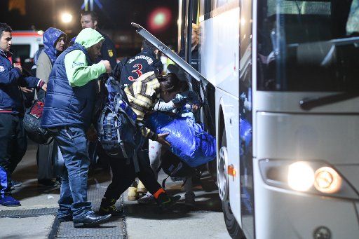 Refugees arrive by bus from Freilassing at the main station in Mannheim, Germany, 29 September 2015. Buses and trains with refugees arrive from southern Germany at Mannheim, from where they are distributed to the states Saarland, Hesse, Rhineland-...