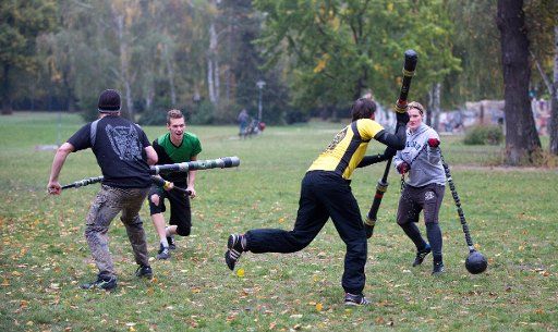 Members of Verein Jugger e.V. play Jugger in Volkspark Friedrichshain park in Berlin, Germany, 07 October 2015. In the sport of Jugger, the ball is a dog skull and the players are armed with lances or spiked maces, which they use to keep their ...