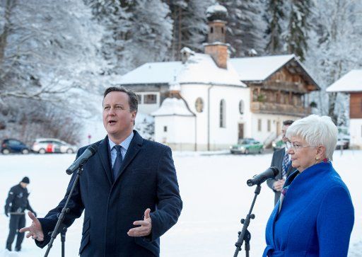 British Prime Minister David Cameron (L) and Gerda Hasselfeldt, chairwoman of the CSU parliamentary group, deliver a statement to journalists at the closed session meeting of the Christian Social Union (CSU) in Wildbad Kreuth, Germany, 07 January ...