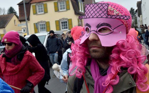 More than 500 people taking part in a demonstration against xenophobia and racism in Dreieich, Germany, 09 January 2016. One man wears a colourful costume. Earlier this week, shots were fired at a refugee accommodation centre in the area. PHOTO: ...