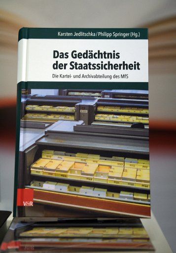 A copy of the book "Das Gedaechtnis der Staatssicherheit" (lit. the memory of state security) pictured at the Stasi documentation offices in Berlin, Germany, 9 February 2016. The report "Das Gedaechtnis der Staatssicherheit" (lit. the memory of ...