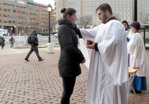 A priest of the Episcopal Historic Christ Church hands \