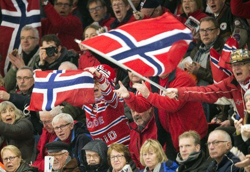 Norwegian fans cheer for their athletes at the ISU World Allround Speed Skating Championships in Berlin, Germany, 05 March 2016. Photo: SOEREN STACHE\/