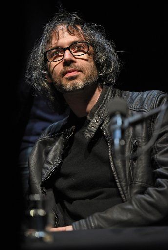 Author and pianist James Rhodes sits on stage during a reading at the Lit.Cologne international literature festival in Cologne, Germany, 12 March 2016. Photo: Henning Kaiser\/