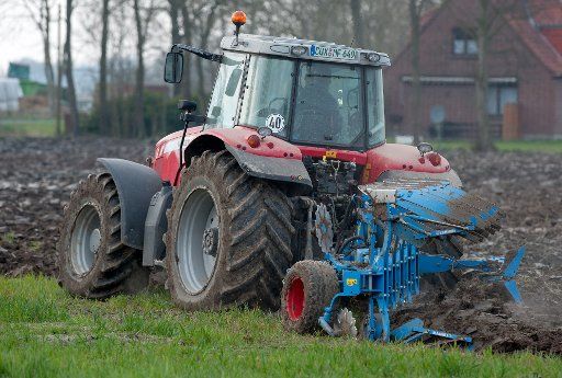 A farmer plows his field near Nordholz, Germany, 12 April 2016. Fieldwork increases with the arrival of spring weather. Photo: INGO WAGNER\/