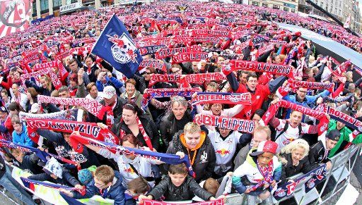 Fans of RB Leipzig celebrating their team\