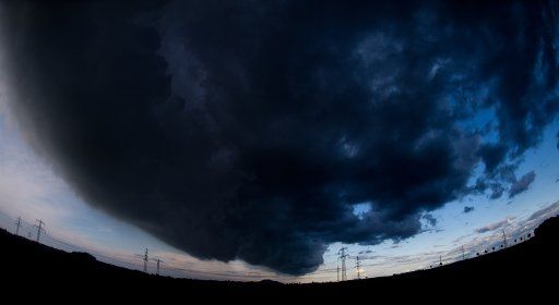 Dark clouds above a field near Sehnde, Germany, 30 May 2016. PHOTO: JULIAN STRATENSCHULTE\/