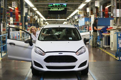 Ford employees assembling and testing cars at the manufactory in Cologne, Germany, 17 June 2016. PHOTO: OLIVER BERG\/