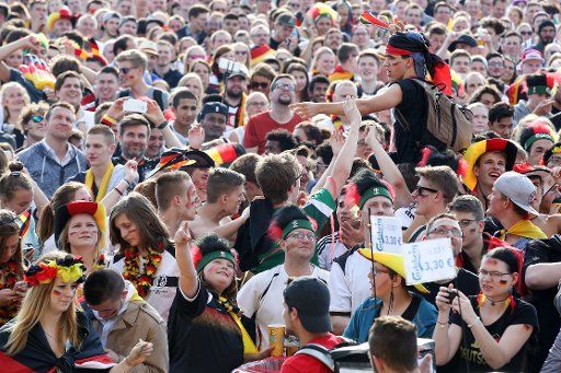 Fans watching the European Championship soccer match between Germany and Northern Ireland at the Public Viewing at Heiligengeistfeld in Hamburg, Germany, 21 June 2016. PHOTO: BODO MARKS\/