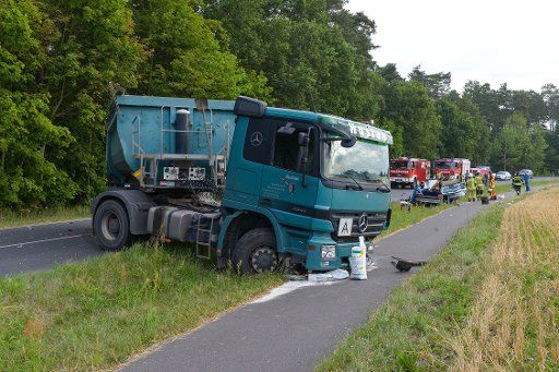 The wrecks of a truck and a car on the highway L20 near Schoenwalde, Germany, 5 July 2016. The 28-year-old driver crashed into the truck for unknown reasons. The driver was able to be retrieved by the fire brigade but died later. PHOTO: JULIAN ...