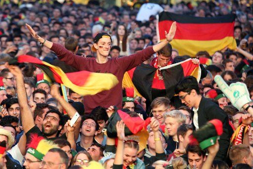 Football supporters at a public viewing of the Euro 2016 semi-final between France and Germany at Heiligengeistfeld in Hamburg, Germany, 7 July 2016. PHOTO: BODO MARKS\/