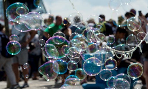 Soap bubbles flying through the air at Bodensee lake in Konstanz, Germany, 29 July 2016. PHOTO: PATRICK SEEGER\/