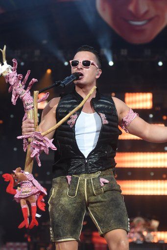 Austrian Volksmusik singer Andreas Gabalier performing during a stadium concert at the Olympia stadium in Munich, Germany, 30 July 2016. PHOTO: FELIX HOERHAGER\/