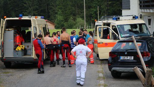 Emergency services near the Buchenegger waterfalls, where a 17-year-old refugee and a 31-year-old guardian died, in Oberstaufen, Germany, 17 August 2016. Police say the 17-year-old lost his footing at the edge of the waterfall and fell from the ...