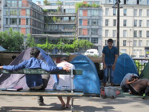 Tents have been set up by migrants near the Stalingrad metro station in Paris, France, 13 September 2016. Similiar unauthorised camps have repeatedly appeared beneath elevated railway tracks or the open sky across the city for months. Photo: Nina ...