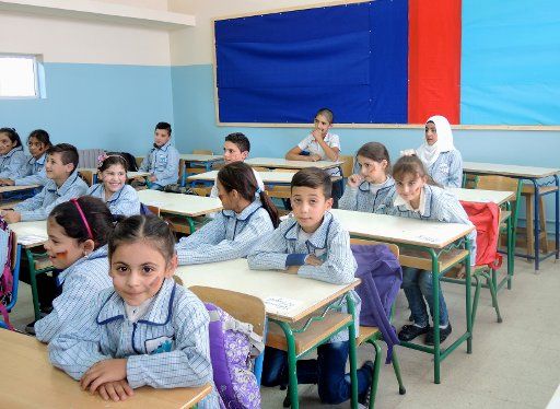 Libanese pupils sit inside a public school in Taalabaja, Lebanon, 6 October 2016. The school building has been renovated with German help. The pledge to teach Syrian refugee children there in the afternoon, when Lebanese pupils are back home, was ...