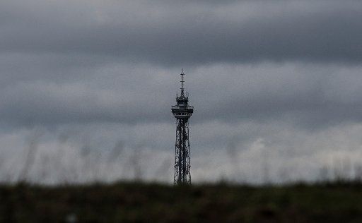 Dark clouds frame the radio tower in Berlin, Germany, 02 November 2016. Photo: PAUL ZINKEN\/