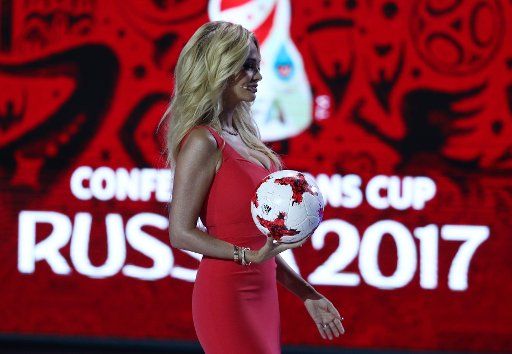 The official representative of the 2018 Football World Cup Victoria Lopyreva, arrives on stage with the offical football at the group draw of the Confederations Cup 2017 at the tennis academy in Kazan, Russia, 26 November 2016. The 8-nation ...
