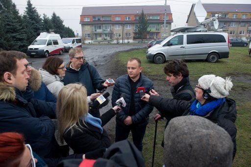 The Polish owner of a freighting company Ariel Zurawski talks to journalists in Sobiemysl, Poland, 20 December 2016. An unknown assailant used a HGV owned by Zurawski\