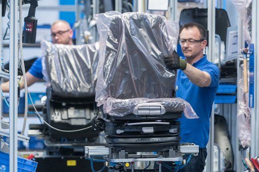Workes seen during production at the car supplier Grammer in Kuemmersbruck, Germany, 10 March 2017. Management and employee representatives want to prevent the takeover of control in the company by the controversial investor family Hastor. Photo: ...