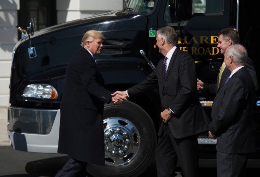 March 23, 2017 - Washington, D.C., United States: President Donald Trump walks out to welcome truckers and CEOs to the White House for a listening session on health care. Credit: Molly Reilly \/ Pool via CNP - NO WIRE SERVICE - Photo: Molly Reilly - ...