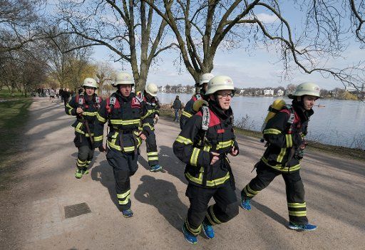 Firefighters under the leadership of Max Plettenberg (front) training for a marathon race along the Outer Alster in Hamburg, Germany, 26 March 2017. The firefighters gather donations for charitable projects with the run. Photo: Axel Heimken\/