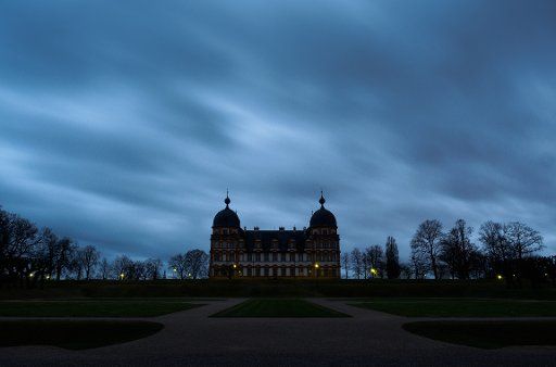Dark clouds pass over the Schloss Seehof castle during the \