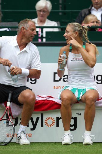 Angelique Kerber of Germany sitting beside Thomas Muster of Austria at the Champions Trophy of the Gerry Weber Open in Halle, Germany, 17 June 2017. Photo: Friso Gentsch\/