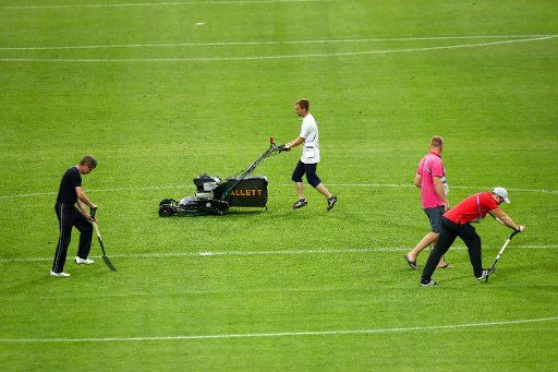 Groundkeepers prepare the turf for upcoming Confederations Cup matches in the Fisht Stadium in Sochi, Russia, 18 June 2017. Germany will face Australia in the stadium on the 19 June 2017. Photo: Christian Charisius\/