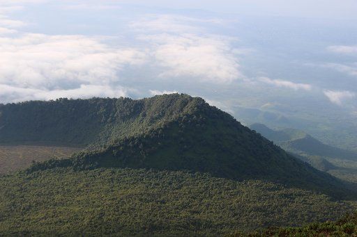 A picture of the Virunga National Park, taken from the rim of the crater of the Nyiragongo volcano and looking over the crater of another, extinct, volcano, taken in North Kivu Province, Democratic Republic of the Congo, 11 December 2016. Photo: Jü...