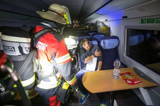 A fire fighter practices the rescue and recovery of a person in an Intercity-Express (ICE) in the ICE-tunnel Blessberg near Mausendorf, Germany, 22 July 2017. On the new ICE railway line Nuremberg-Erfurt hundred of rescue workers practiced the case ...