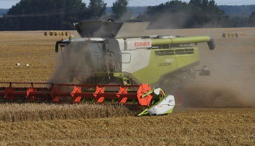 Farmers are engaged in grain harvest near Wolgast, Germany, 19 July 2017. The State Farmer\