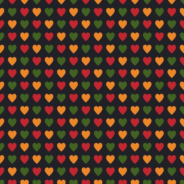 Seamless pattern with hearts in traditional Pan African colors - red, yellow, green, black background. Backdrop for Kwanzaa, Black history month, Black Love Day, Juneteenth greeting card, poster, banner
