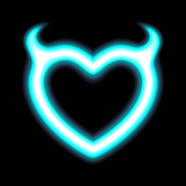 Heart neon or blue glow radiant effect of love with Devil horns for Valentines day Halloween. Holiday design, night of love. Luminescent vector art illumination illustration. Isolated on black or dark