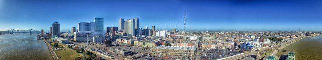 NEW ORLEANS - FEBRUARY 11, 2016: Aerial panorama of city skyline. New Orleans attracts 10 million tourists annually.