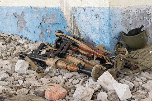 RPG-7 grenade launchers on the rocks in the destroyed building