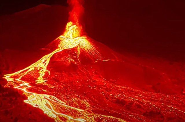 Hot lava continues to gush from the Spanish Cumbre Vieja volcano on Friday Oct 15, 2021. About 300 more people fled their homes early on Thursday as flows of molten rock threatened to engulf another area in La Palma since the eruption began on 19 September. InnovaLaPalma via EYEPRESS