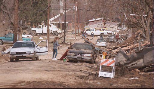 KRT NEWS STORY SLUGGED: FLOODING KRT PHOTOGRAPH BY JANET WORNE\/LEXINGTON HERALD-LEADER (KRT13-March 7) Residents of Falmouth, Kentucky, examine flood damage Friday after they were allowed back into town. The area was hit by the worst flooding of the...