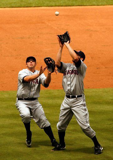 Chicago White Sox third baseman Josh Fields and pitcher Jon Garland go after a ball hit by Kansas City Royals Mark Teahan in Kansas City Missouri, Sunday, July 1, 2007. (Allison Long\/Kansas City Star\/MCT)