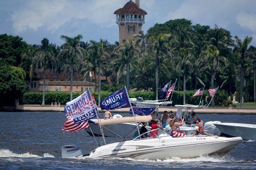 Boats participate in a Flag Day pro-Trump flotilla in front of the former president\